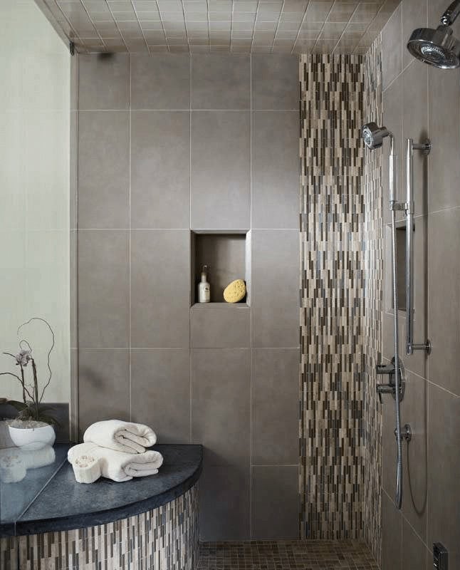 Shower tile ideas with vertical mosaic accent strip, large rectangular wall tiles and coordinating tiled ceiling and bench
