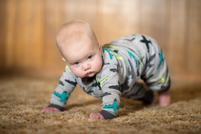 Baby crawling on carpet