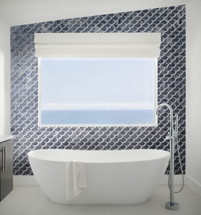 Bathroom with uniquely shaped ceramic tile feature wall