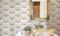 Wallpapered-look bathroom backsplash tile with a gold design