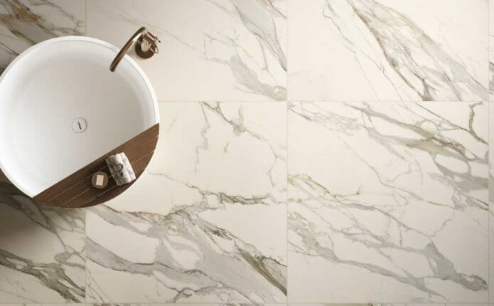 bathroom sink with marble style tile