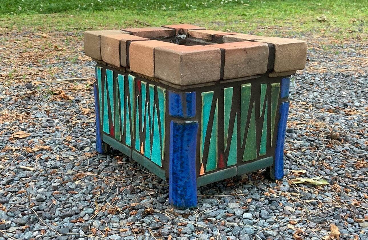 Plant box made by Will Mead with ceramic tile, rolled and extruded glazed terracotta and stoneware and jewel tones