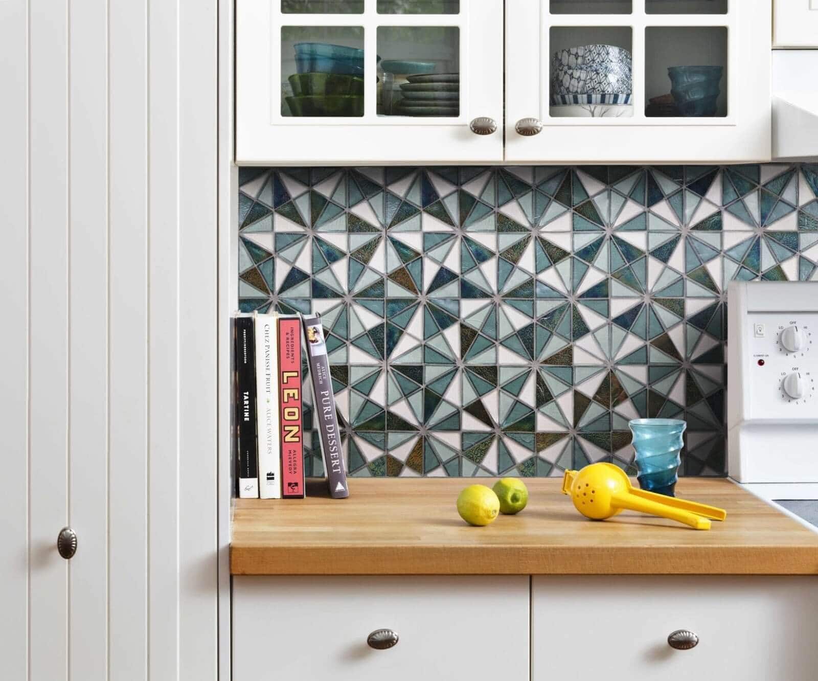 Blue and white triangle tiles combined to form hexagon tiles in a kitchen backsplash