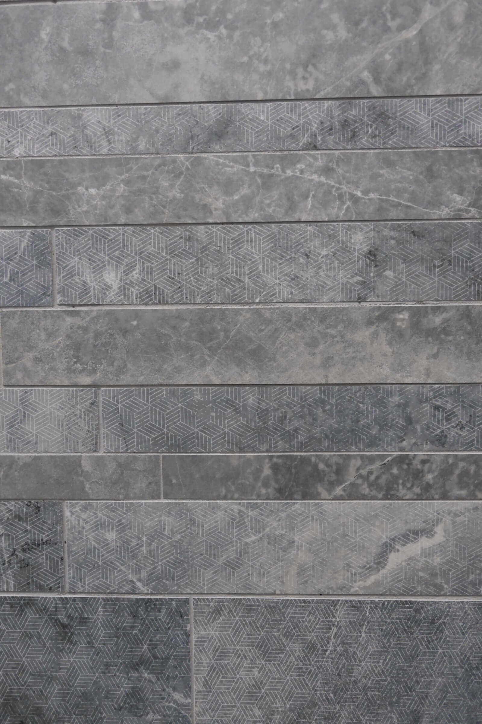 Skinny grey tile with geometric design