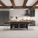 Kitchen with cream tile flooring and backsplash