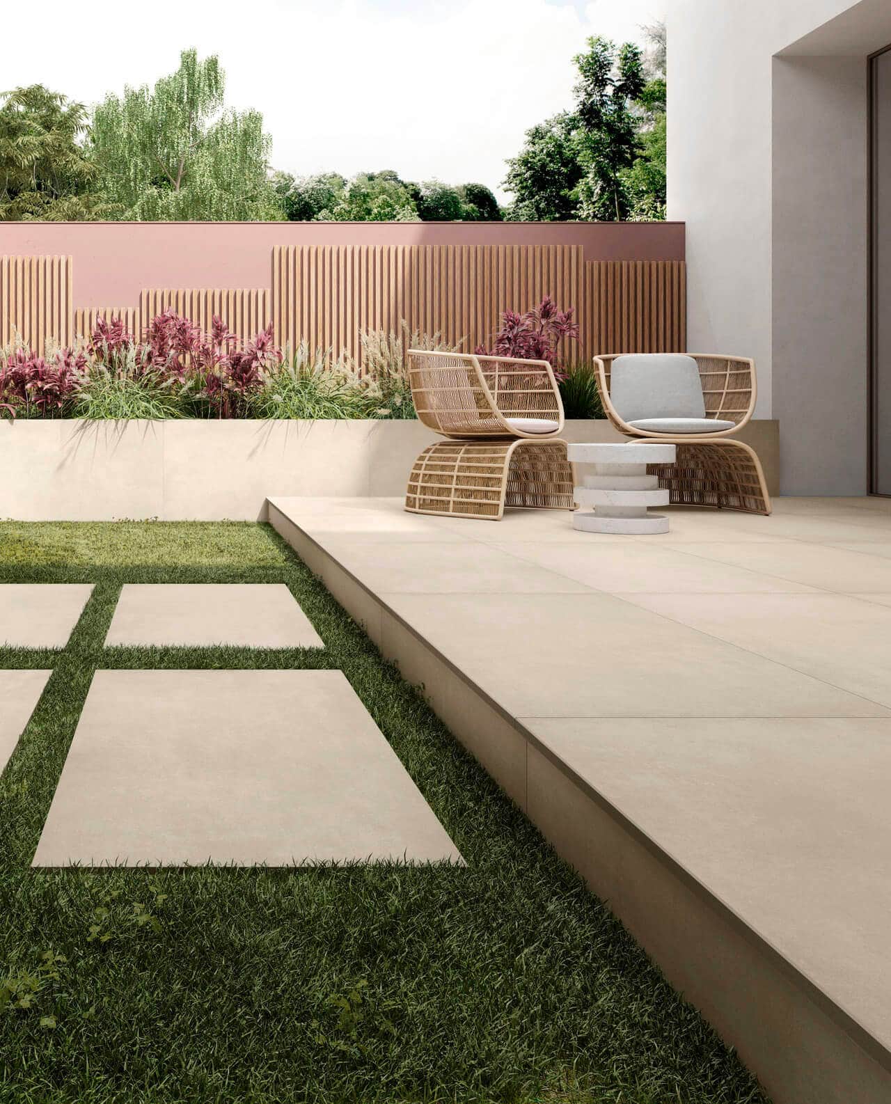 Outdoor seating space with cream porcelain pavers with grass in between