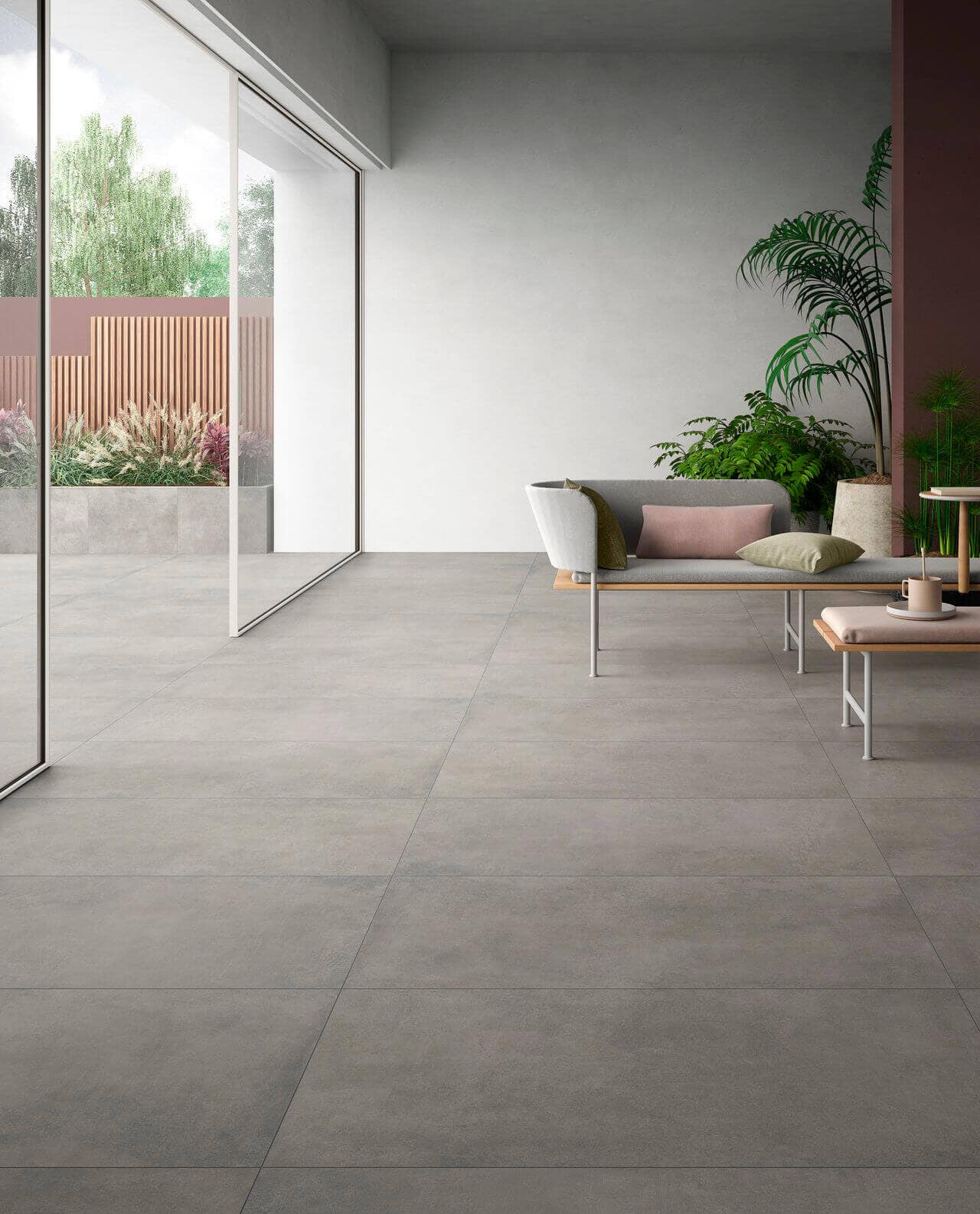 Indoor-outdoor transition by using  gray porcelain paver look 