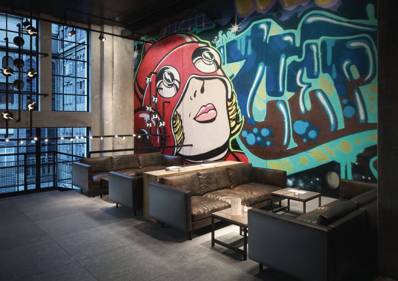 Custom-designed gauged porcelain tile panel featuring bold graphic artwork as a statement wall