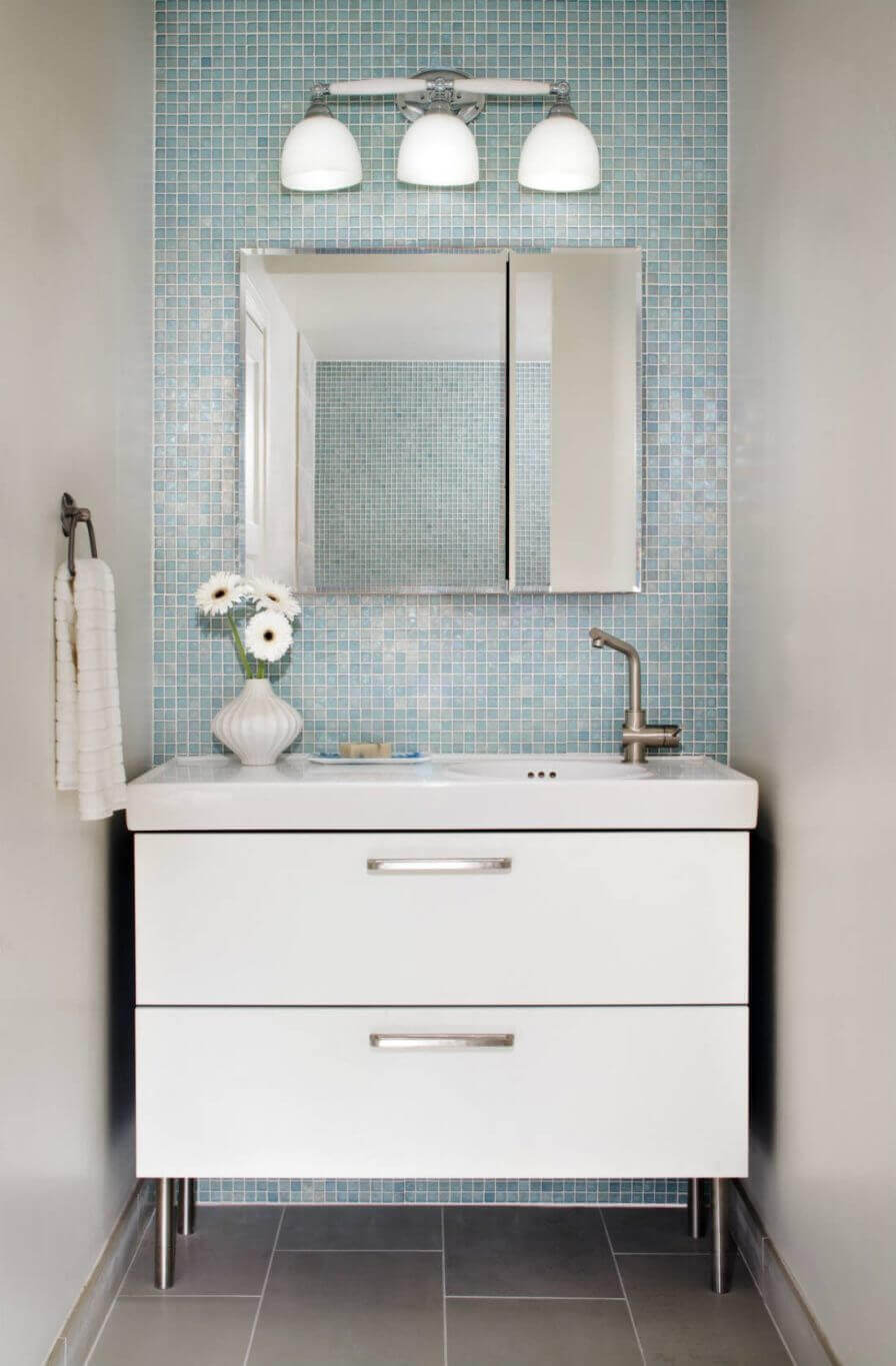 Blue powder room with mini tile grid in baby blue

