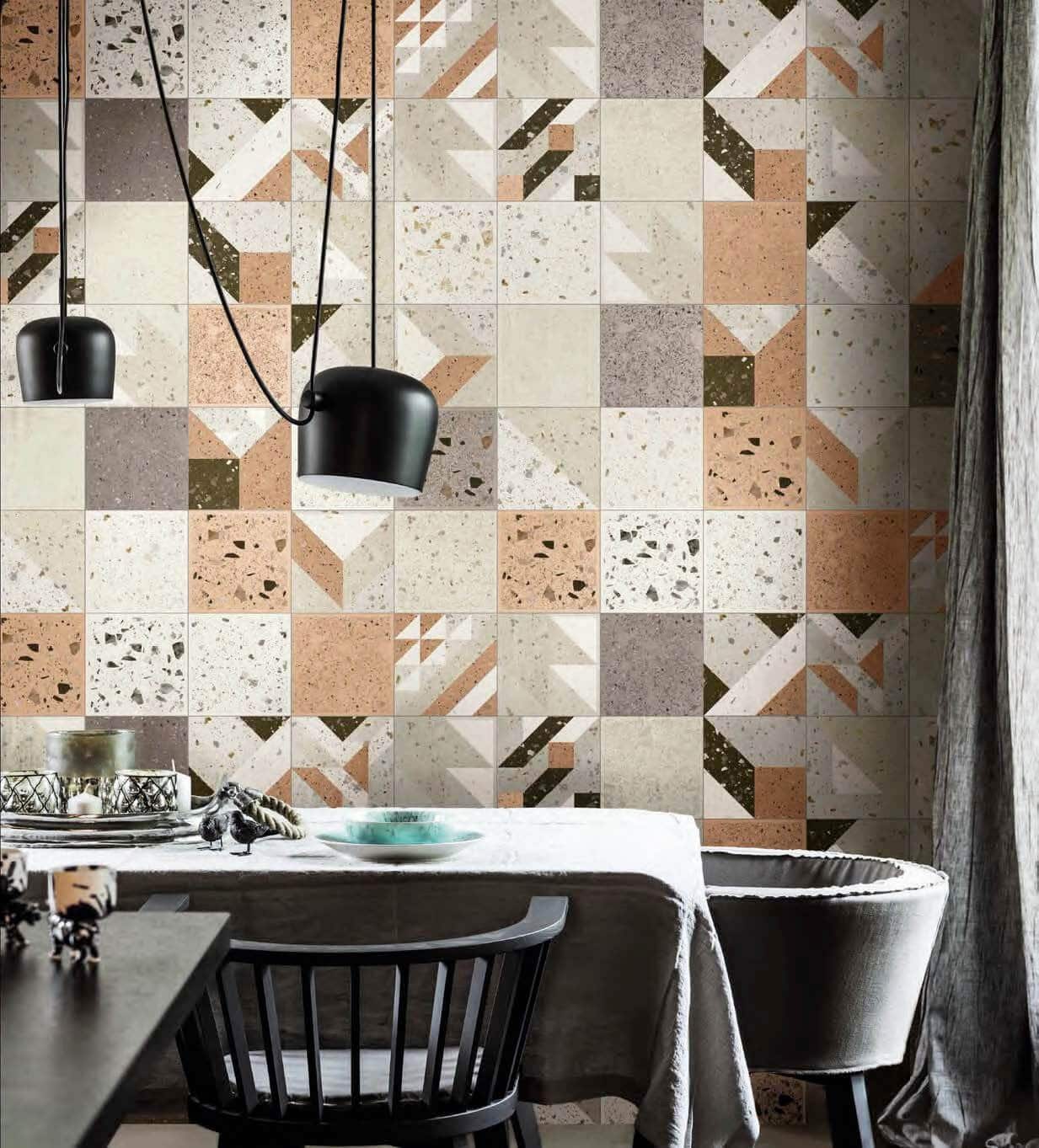 Wall with arrangement of cream, gray and blush wall tiles in terrazzo looks and patterned designs