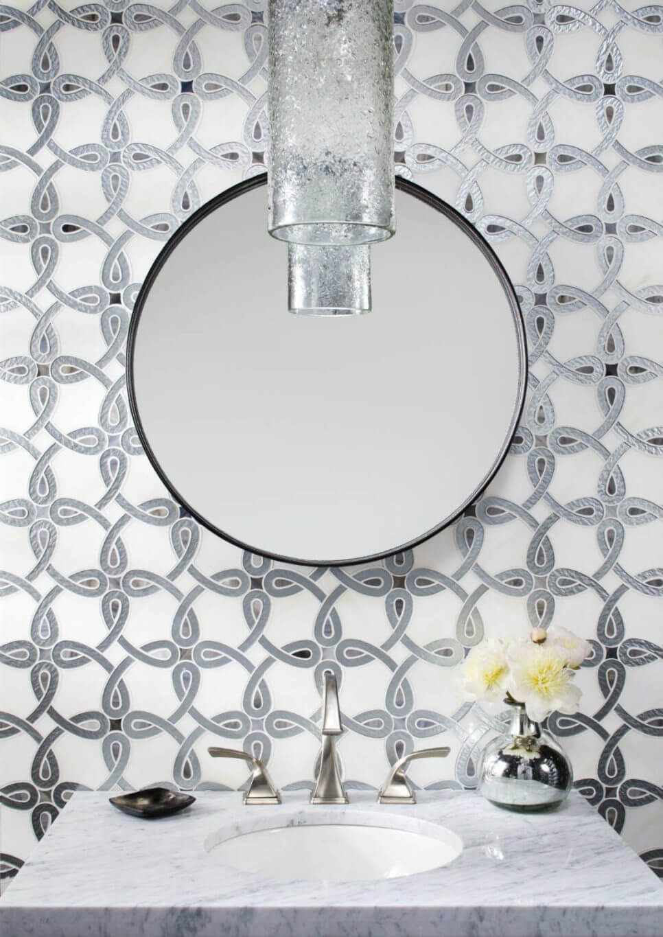 White wallpapered-look powder room backsplash tile with a silver design