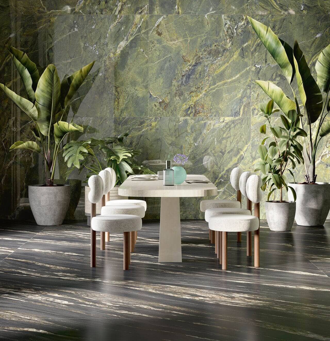 Green floor to ceiling marble-look tile for dining space