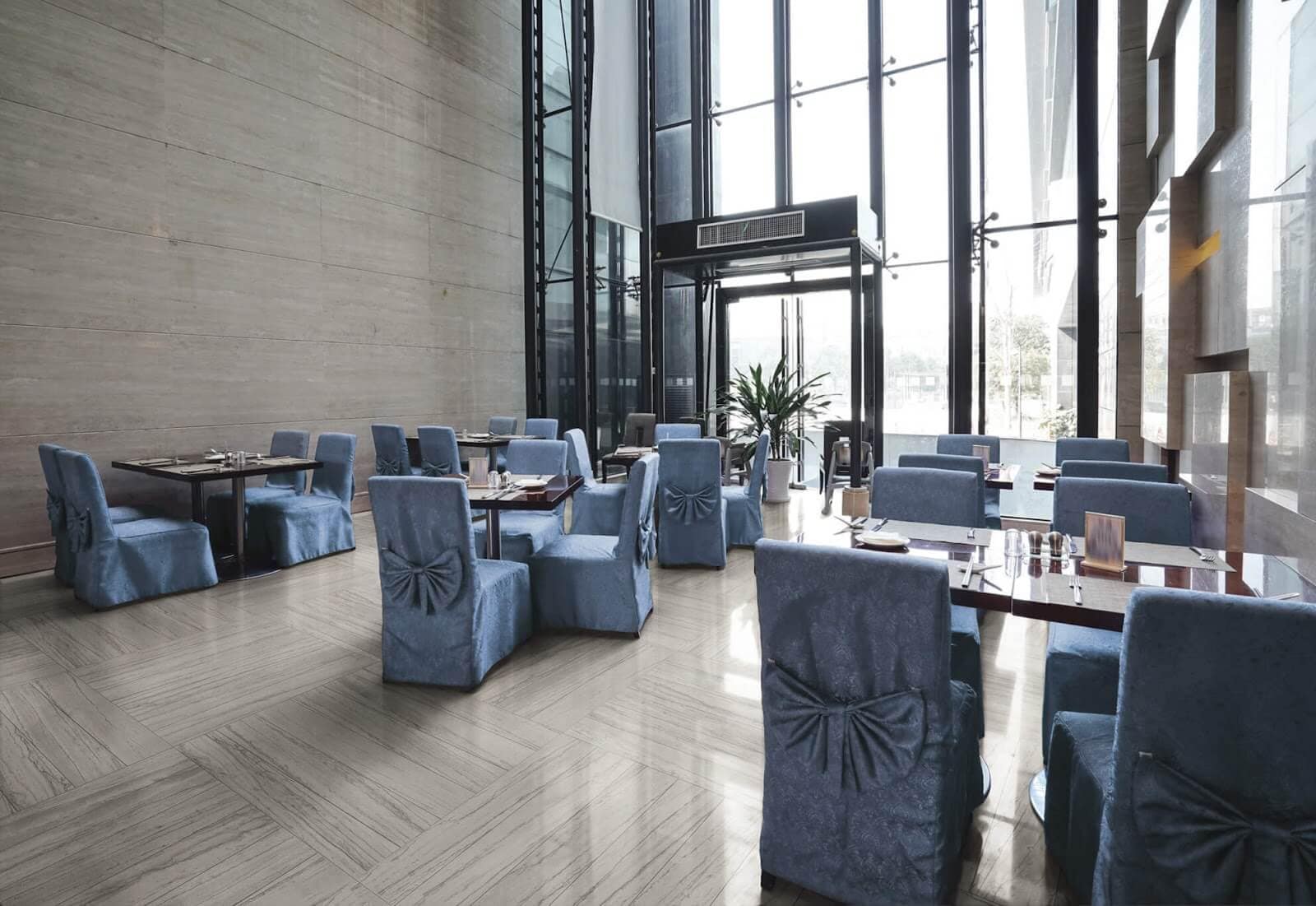 Dining space in hotel with creamy ceramic tiles