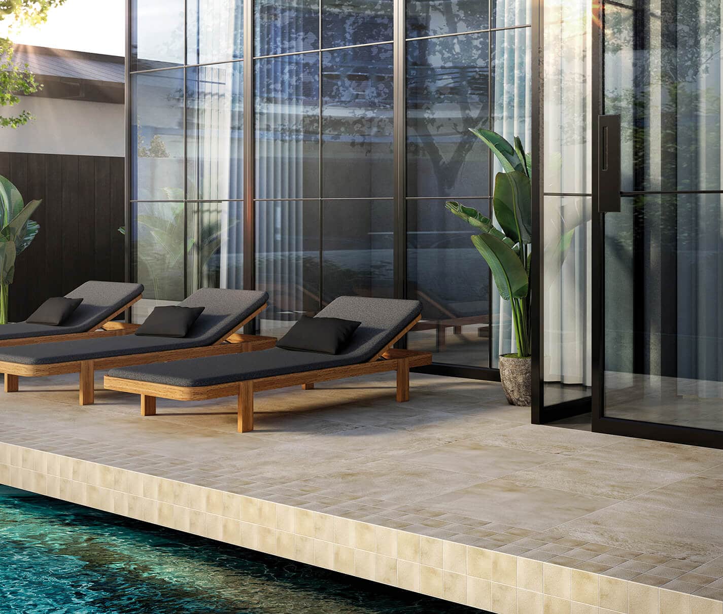 Outdoor swimming pool hotel area with brown, natural-look tiles