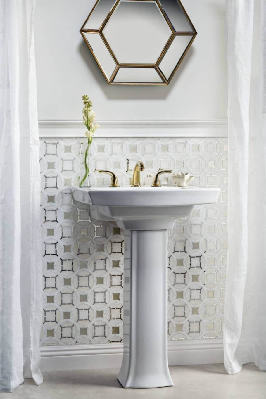 Bathroom backsplash tile with an interlocking circle design and metallic touches