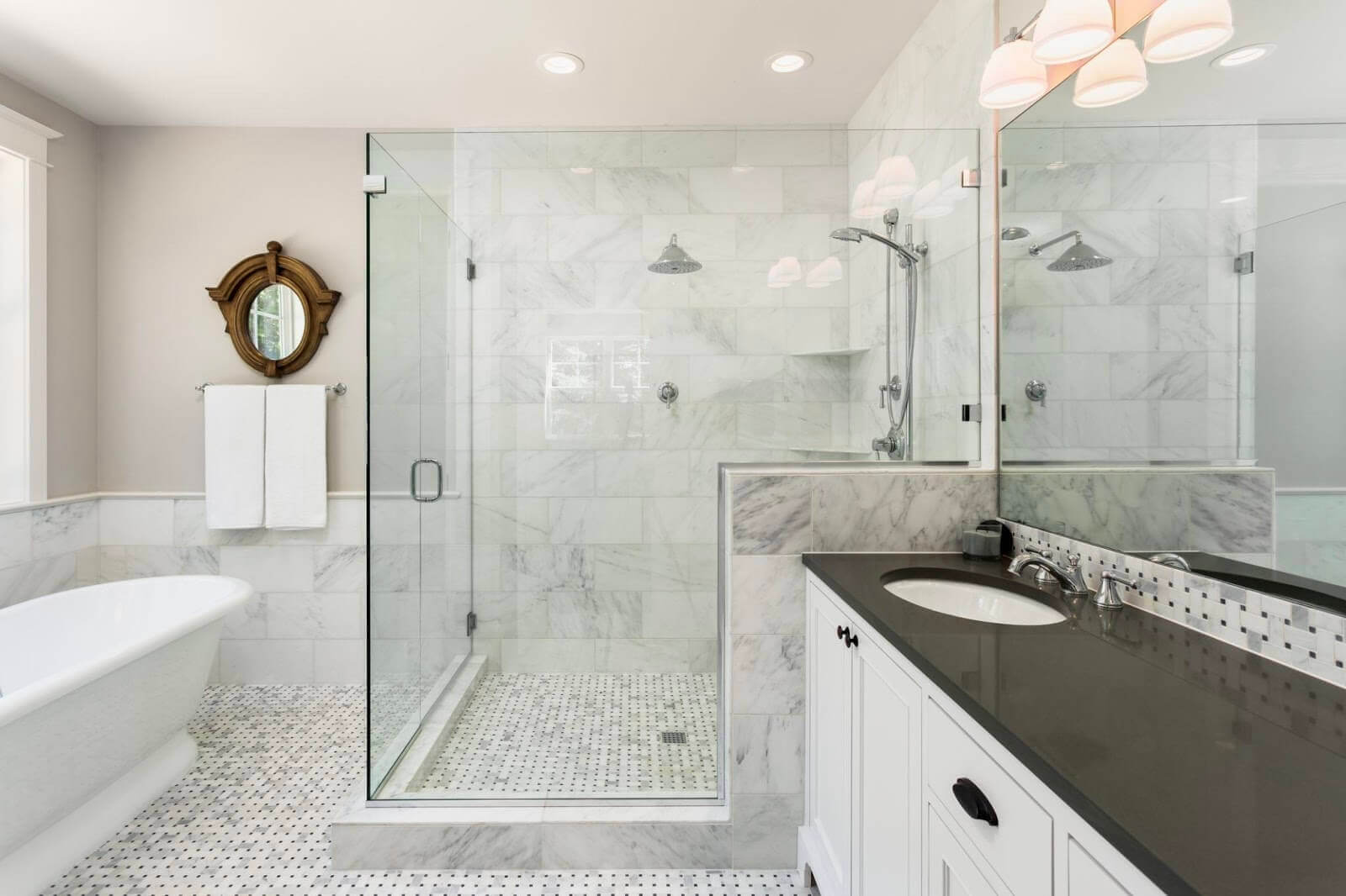 Octagon and dot tile in a marble-look mosaic for spacious bathroom