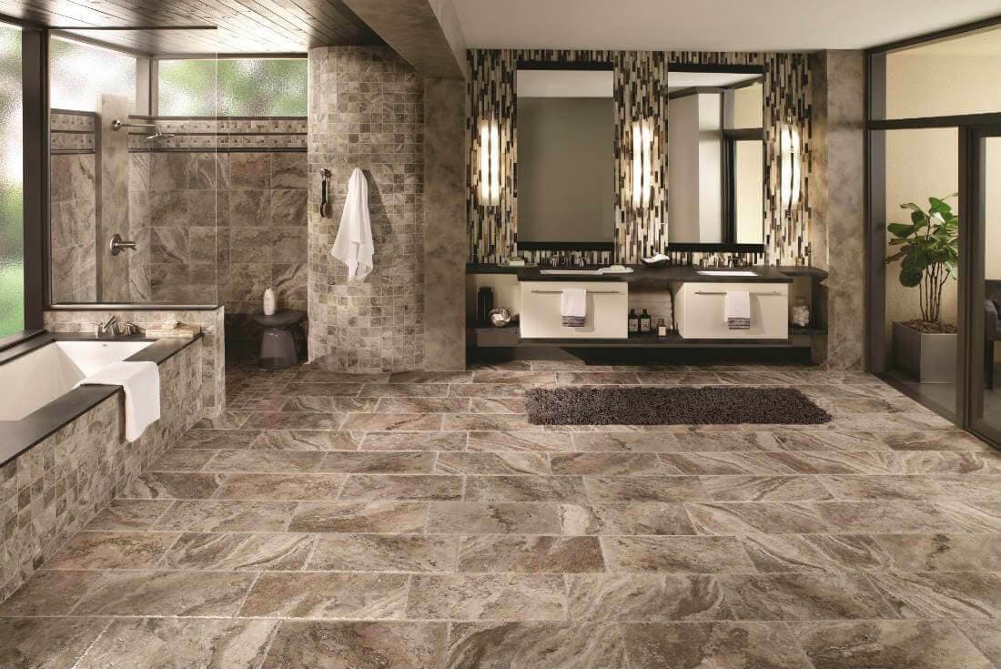 Large bathroom with earth-toned mosaic tile panels


