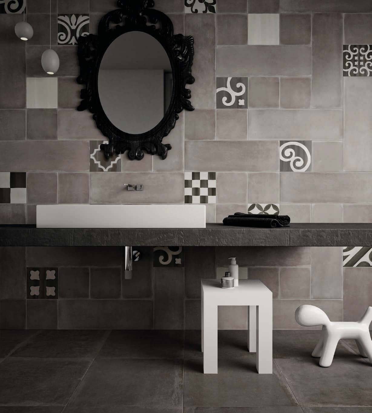 Gray cement-look powder room wall tile with patterned tile interspersed