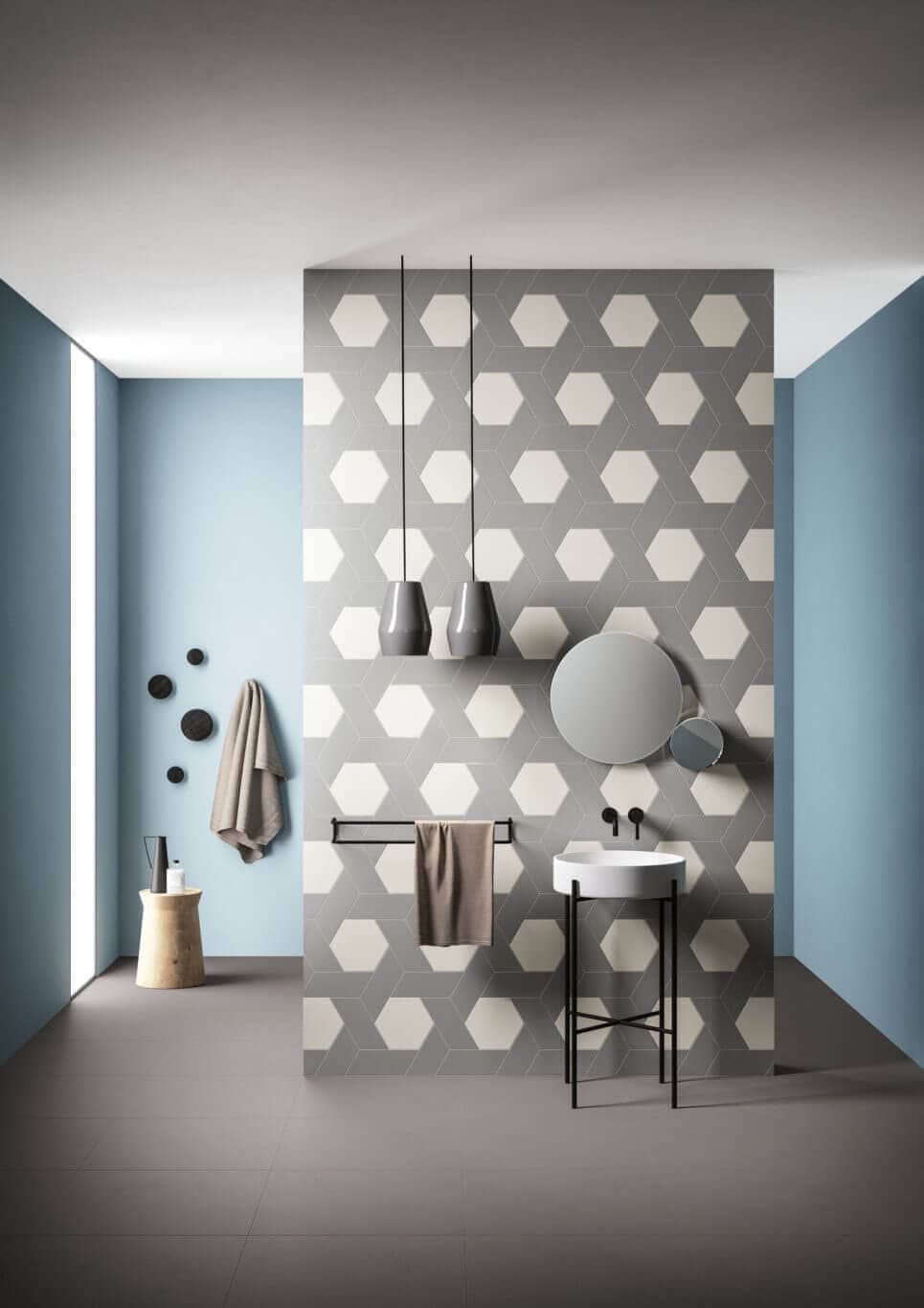 Hexagon tiles interlaced with rhomboid tiles on a bathroom wall