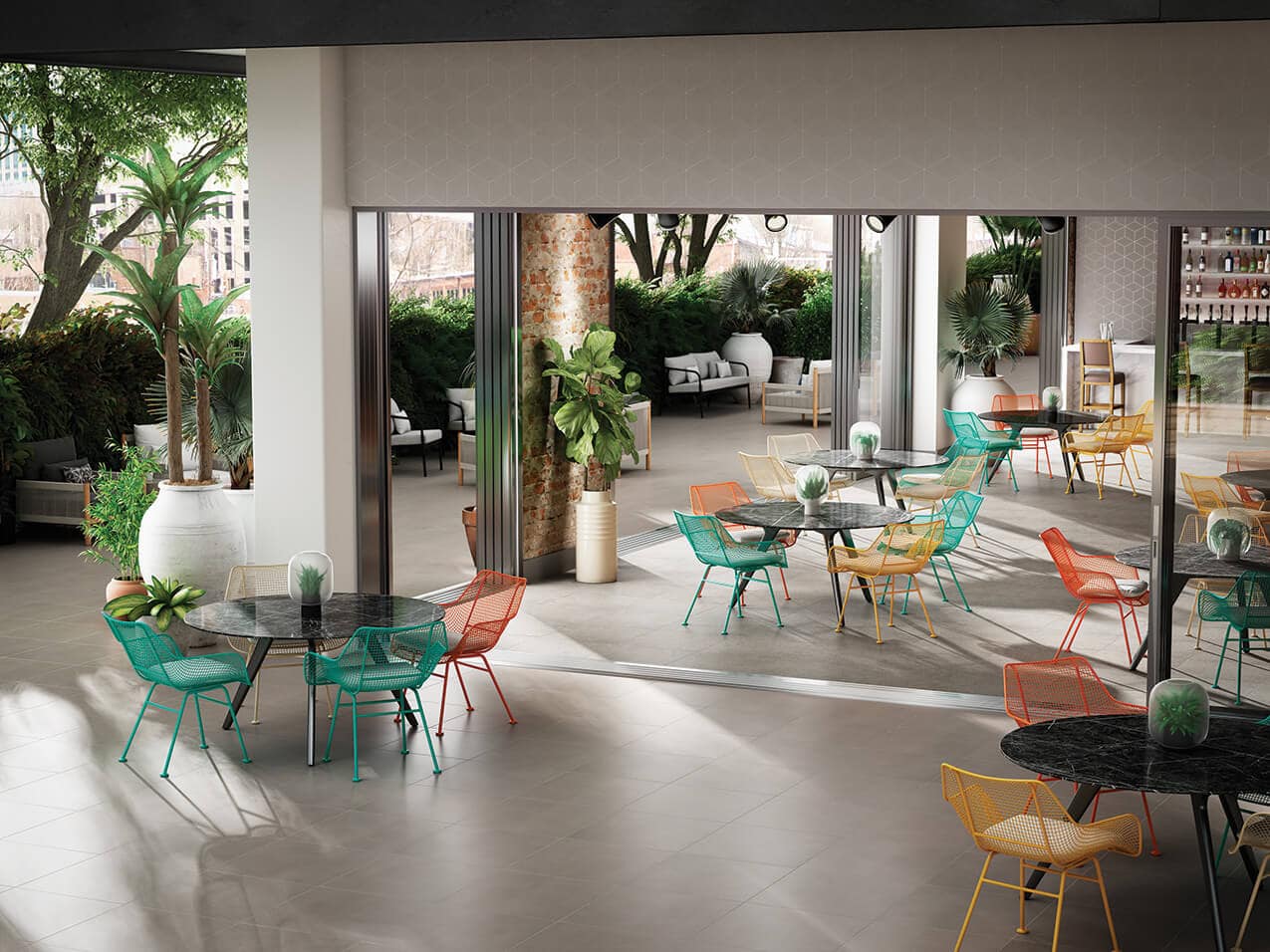 indoor-outdoor restaurant tables with gray ceramic tile flooring