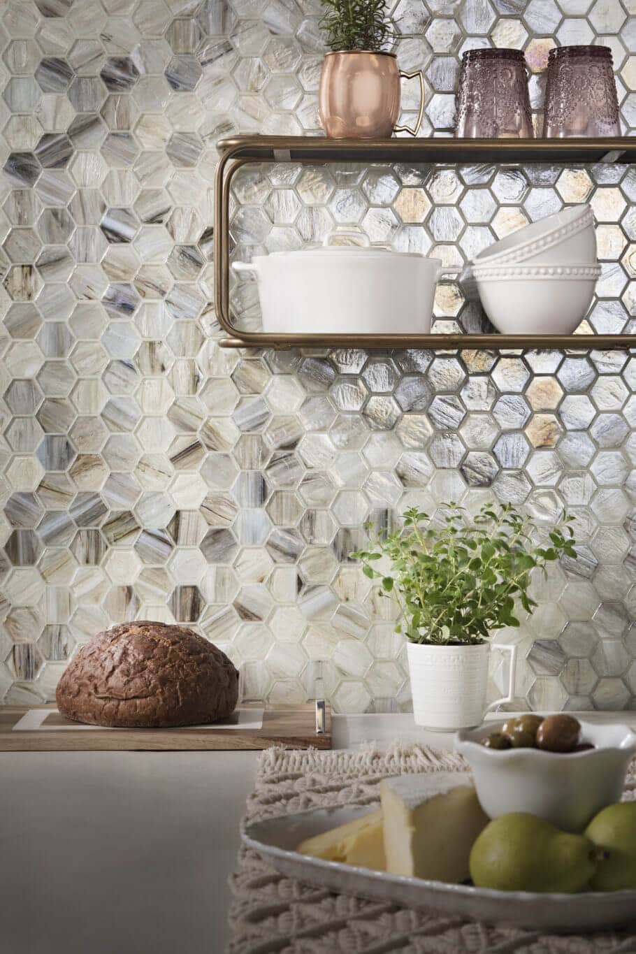 Kitchen backsplash with variegated, iridescent hexagon mosaic tile