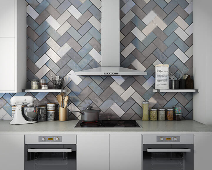 Kitchen wall with earthy subway tile in a herringbone pattern
