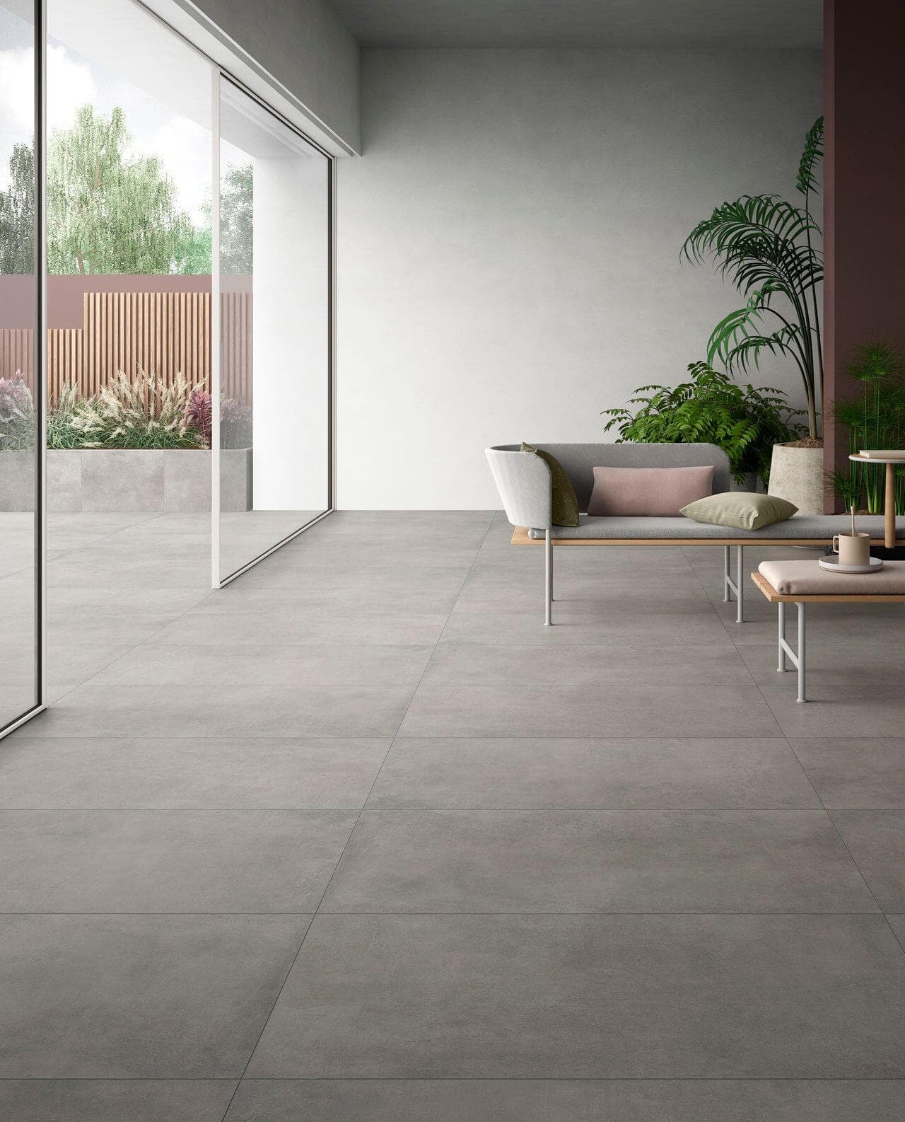 Concrete-look ceramic tile in an indoor-outdoor living room