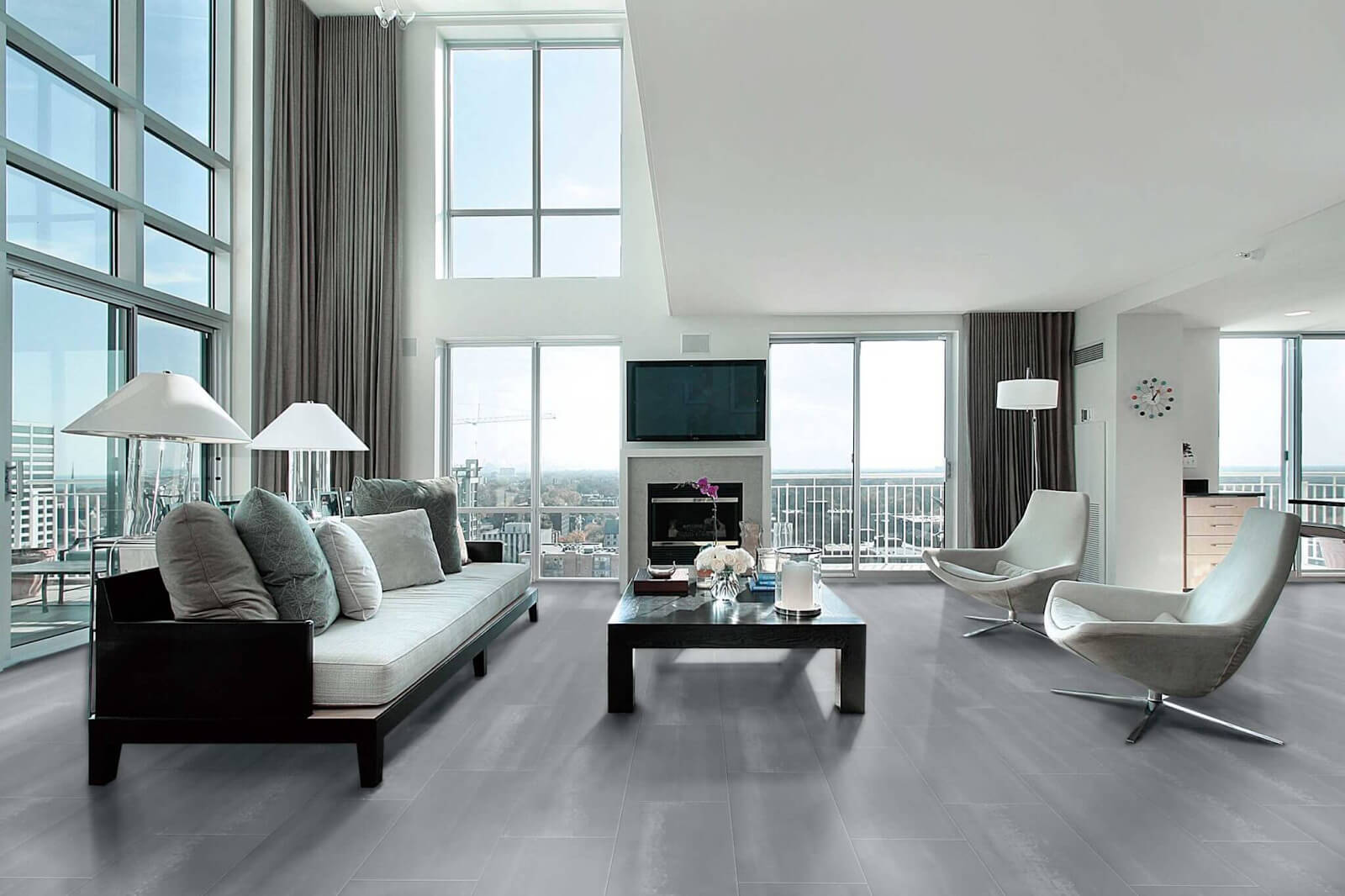 spacious living room with big, tall windows and gray wood-look tile flooring