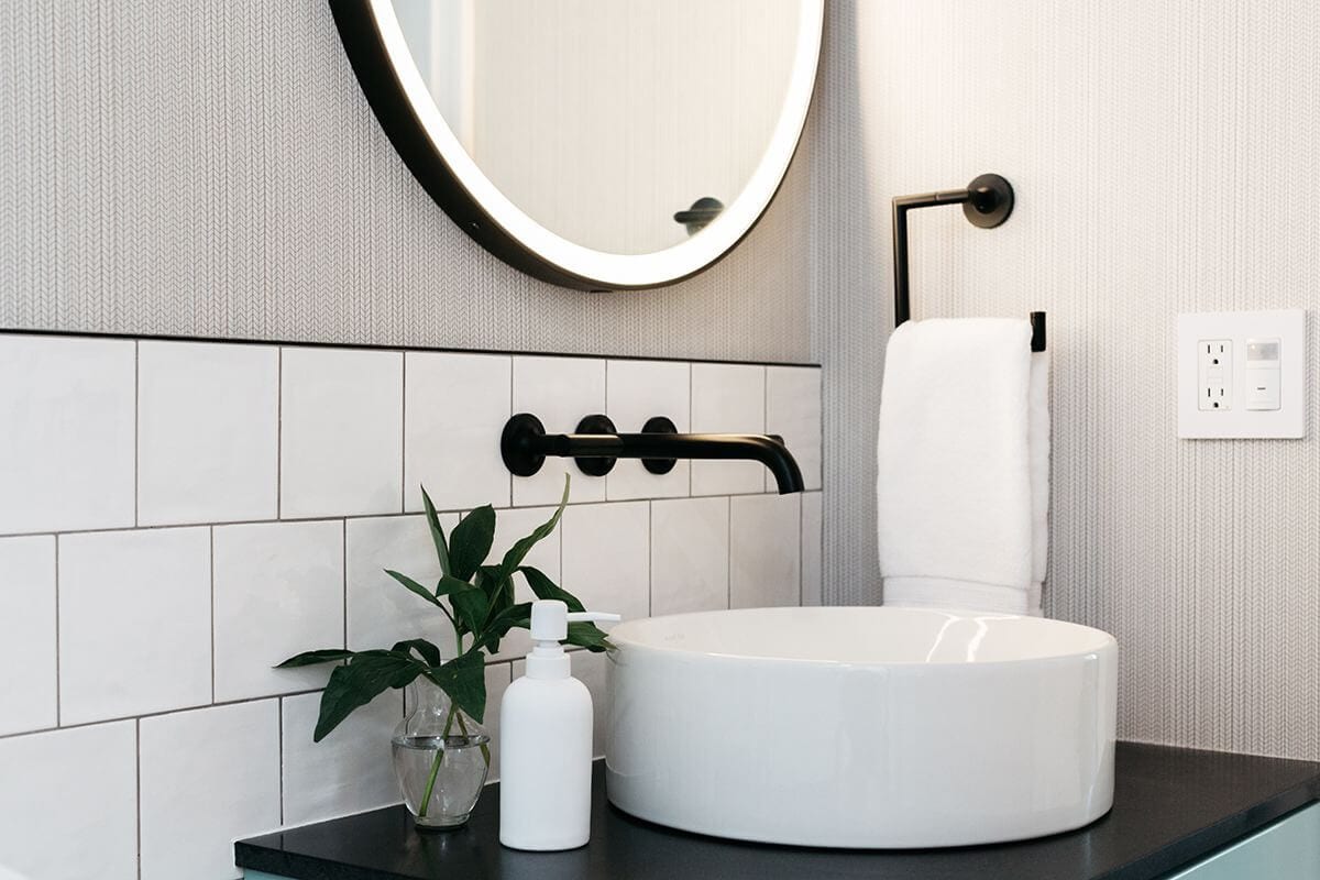 Bathroom backsplash with offset white square tile