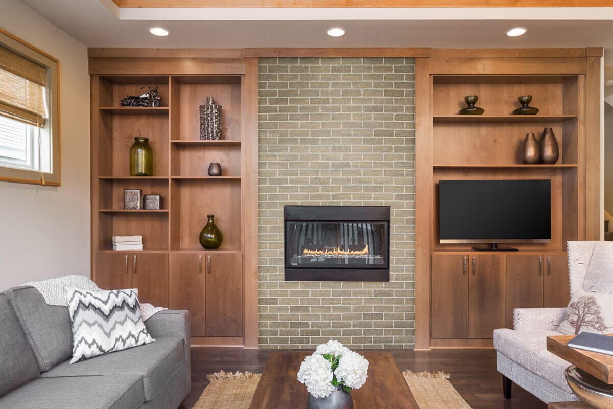 fireplace space surrounded by subway tile wall