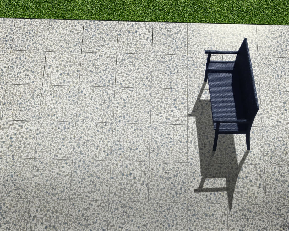 chair in the middle of patio with terrazzo-look tile flooring
