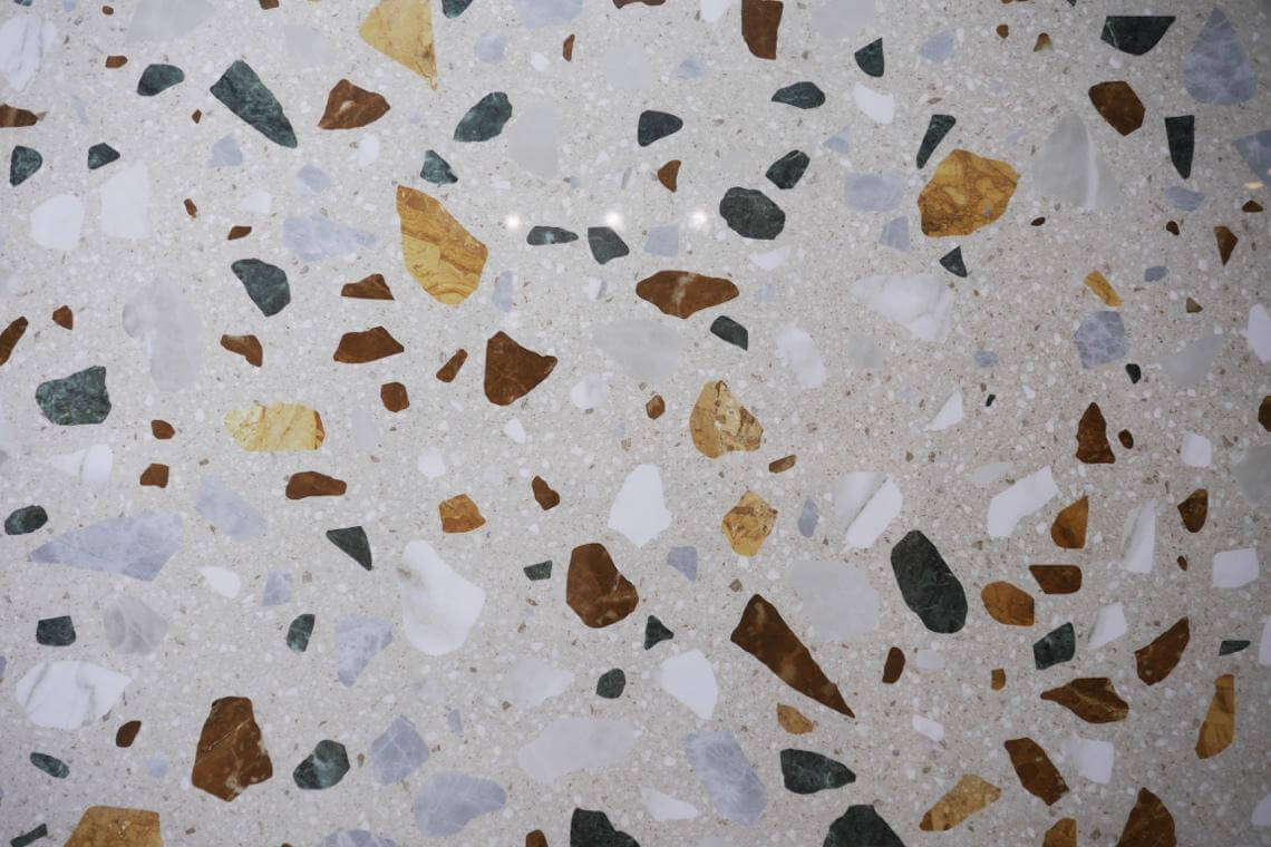 Close-up of terrazzo-look tile with large chips in different colors