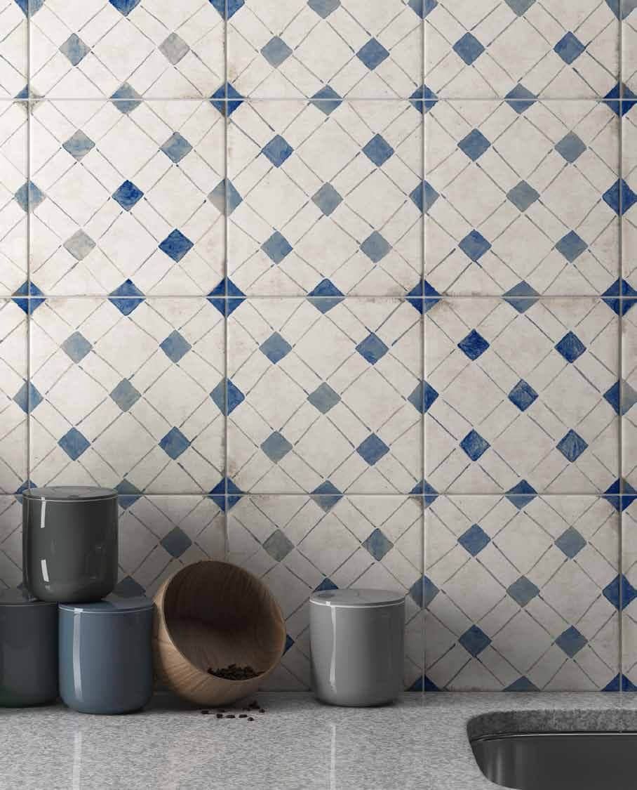 Square tile kitchen backsplash with a blue pattern