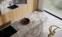 Bird's eye view of white and gray marble-look panel countertop in a bright kitchen.