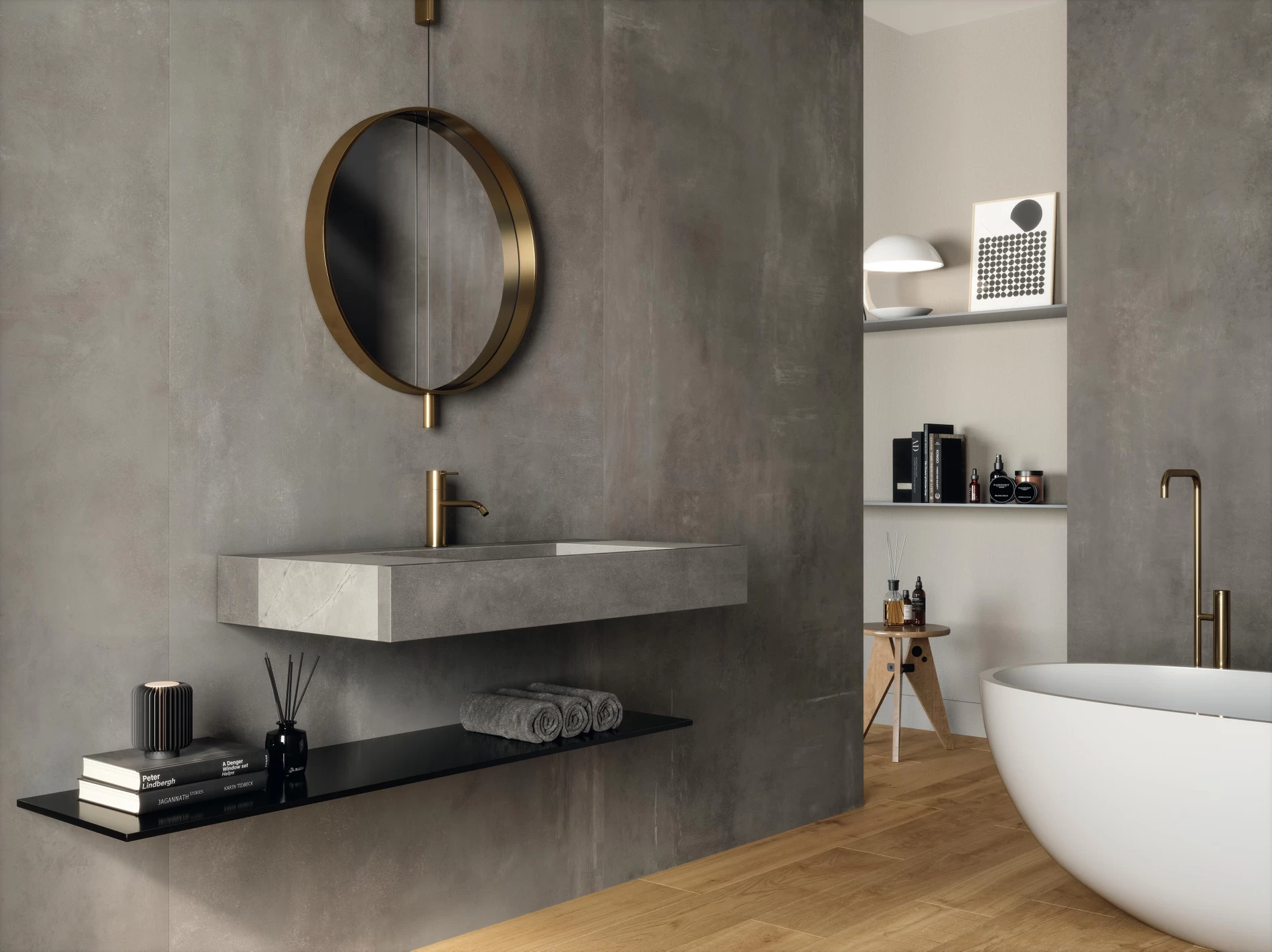 A bathroom with gray stone-look tile on the walls and sink counter.