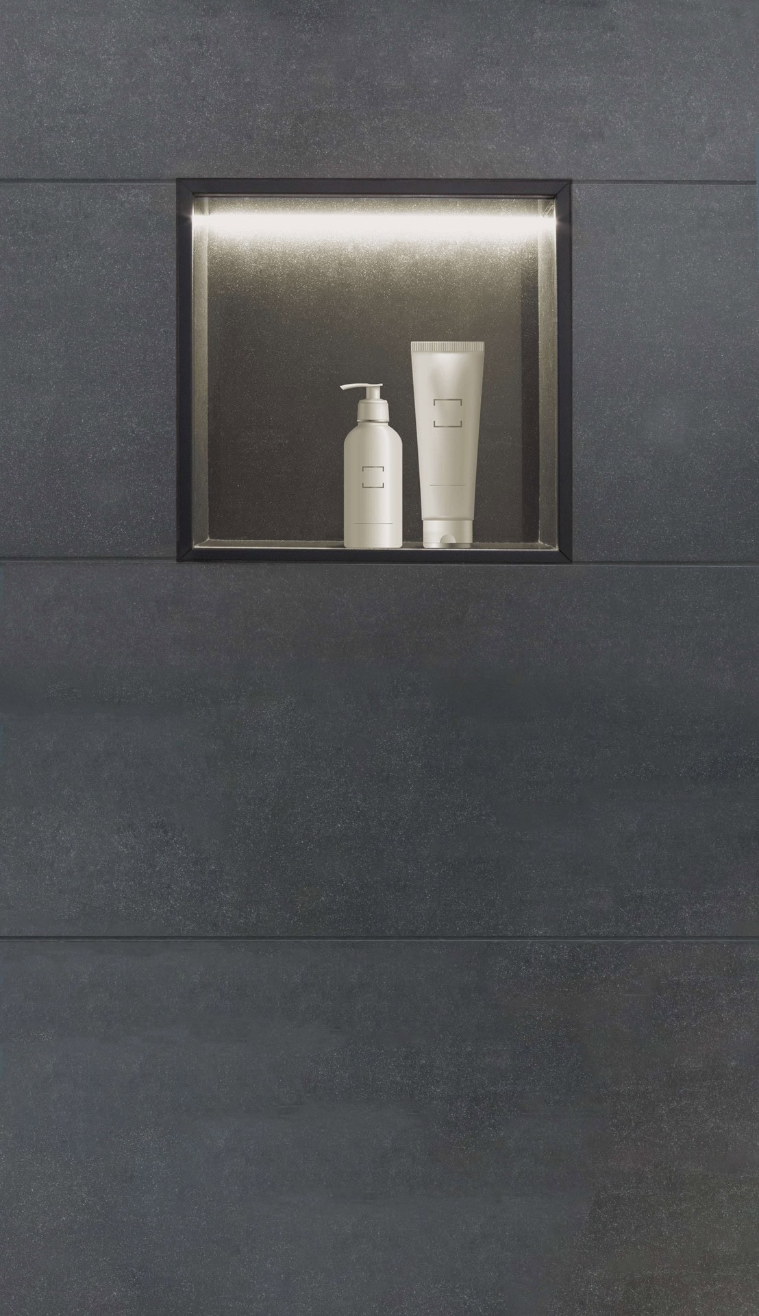 Metal profiles frame this lighted shower niche, surrounded by slate-look tile walls