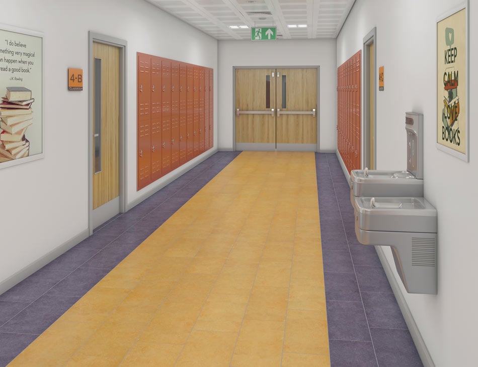 School hallway with yellow ceramic floor tile accented by parallel indigo borders