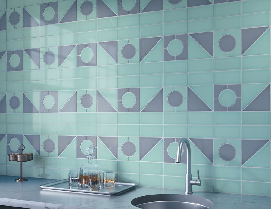 Wet bar backsplash with aqua and gray geometric tile in a horizontal coursing layout featuring repeating circle and triangles
