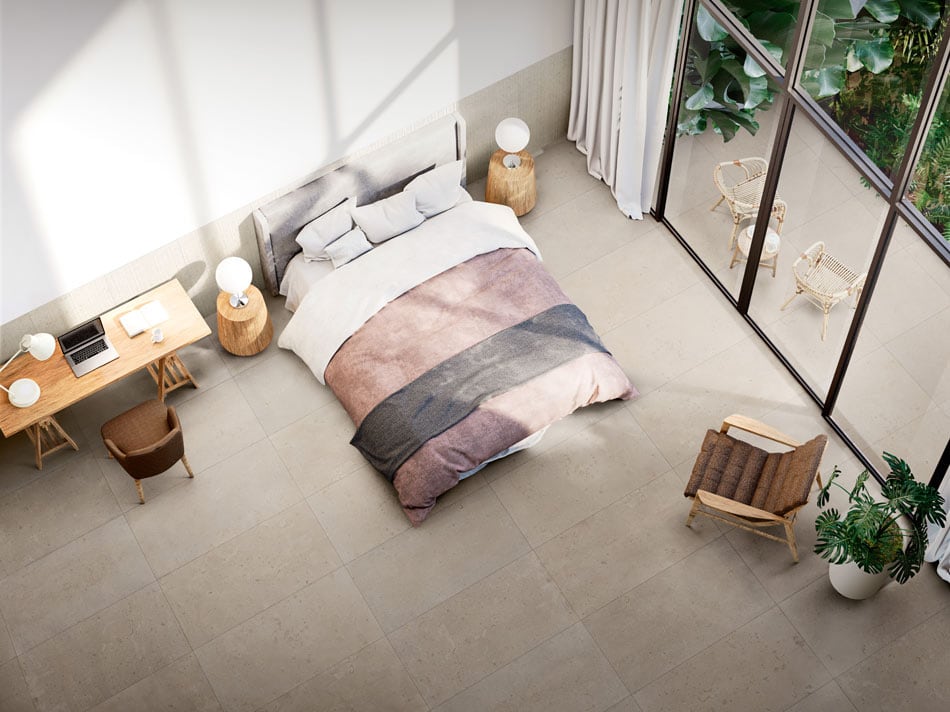 Teen bedroom with beige terrazzo-look floor tile in a neat grid extending to the patio