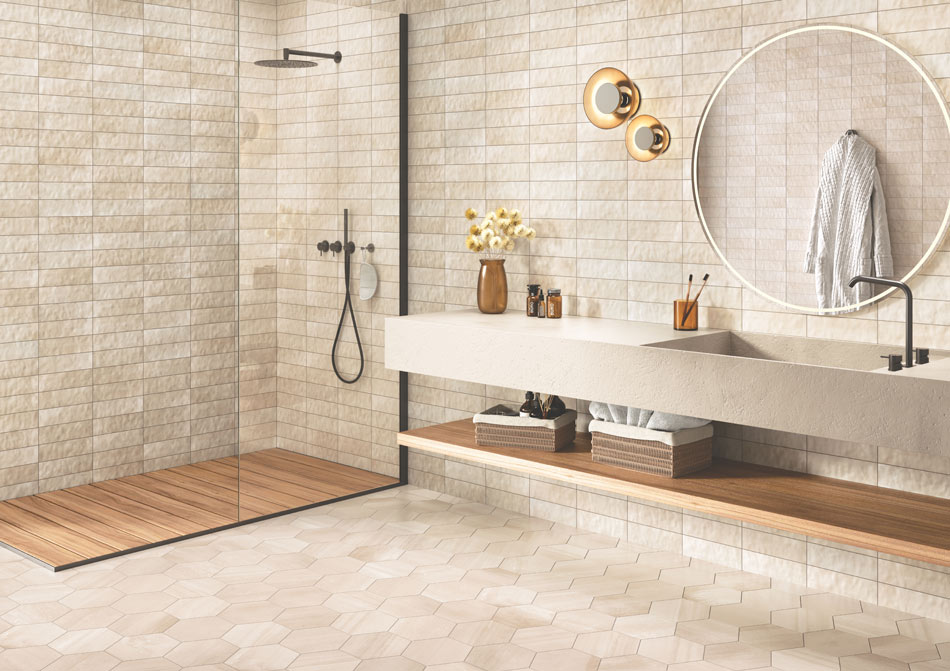 Open-concept bathroom with mushroom-brown zellige wall tile, and hexagon travertine-look floor tile