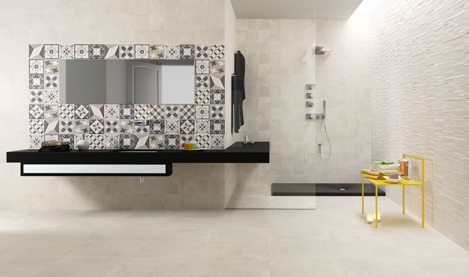 Monochrome stone-look tile with patterned backsplash in an open-concept bathroom
