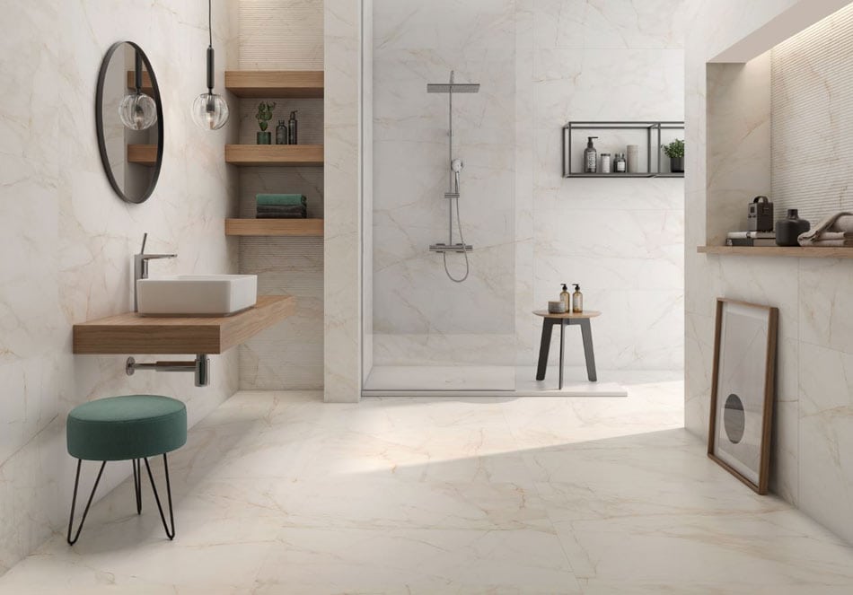 Marble-look tile panels and floating shelves in a contemporary open bathroom