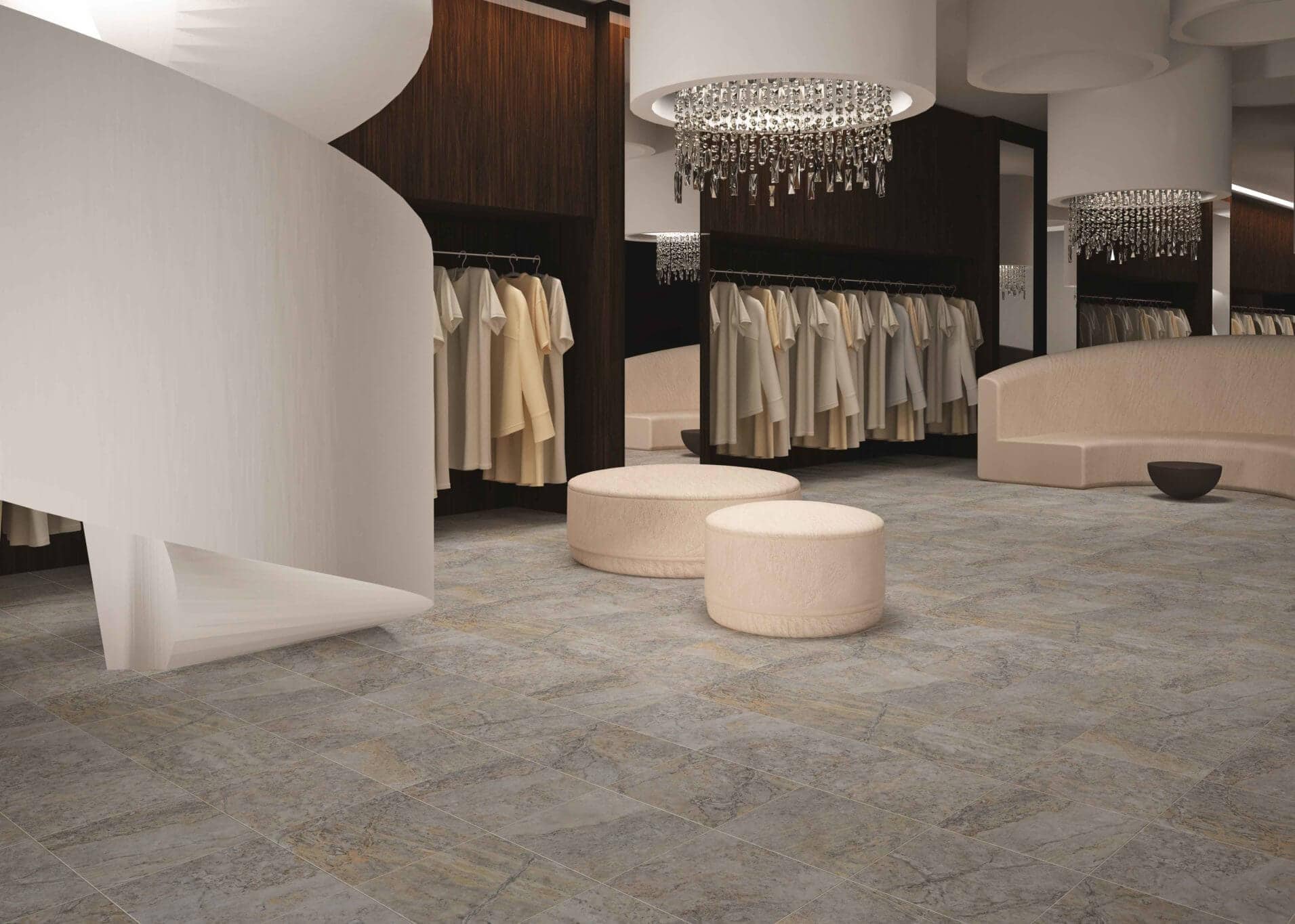 Elegant ceramic tile flooring in a retail clothing boutique featuring stone-look tiles and soft beige seating