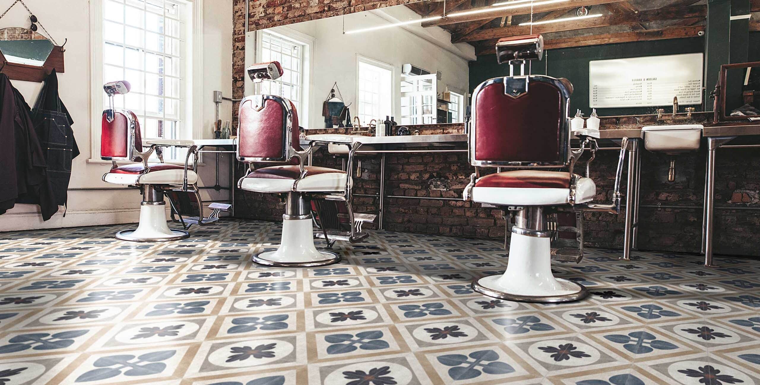 Vintage barbershop with patterned ceramic salon floor tiles in beige, blue, and brown tones