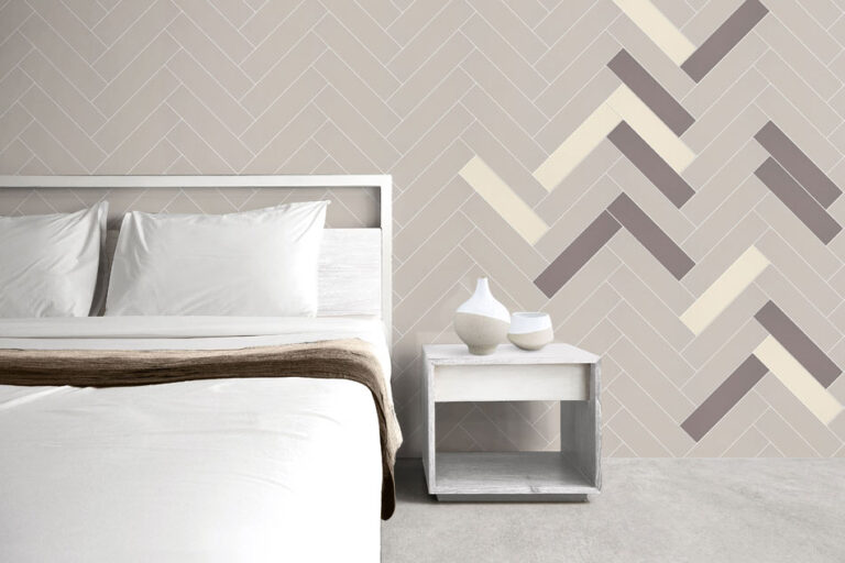 Random tile pattern on bedroom wall with herringbone layout mixing beige, brown and bone-white matte tiles