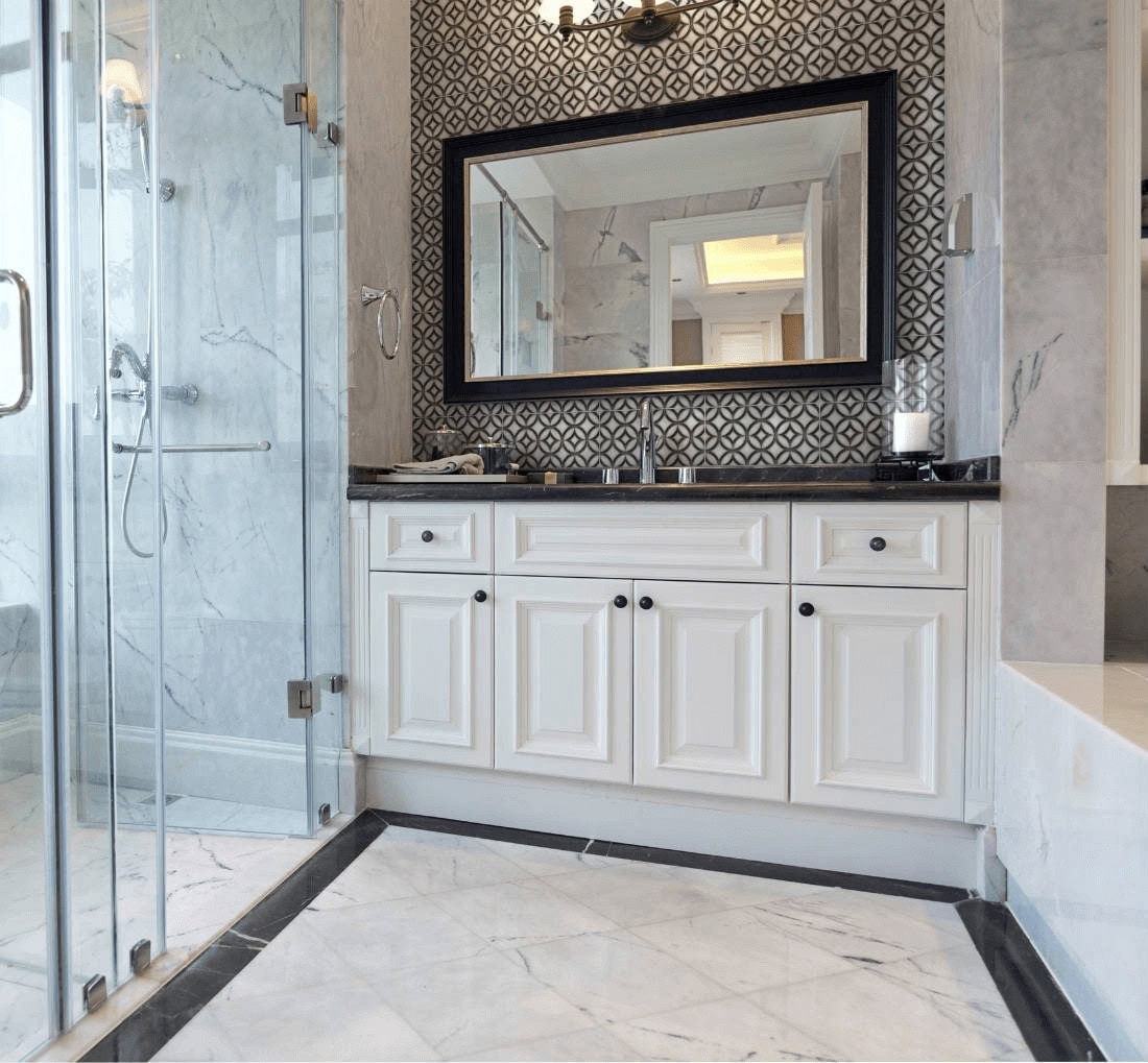 Bathroom shower tile ideas with marble-look walls, diamond grid floor tile and geometric patterned backsplash