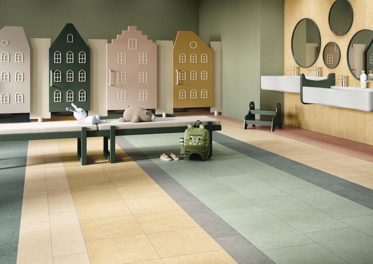 Kid's space interior with red-orange brick-look wall tile and avocado-green tile