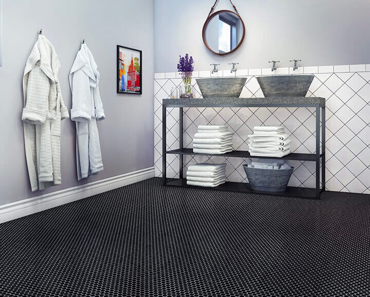 Industrial type bathroom with diagonally laid white square tiles