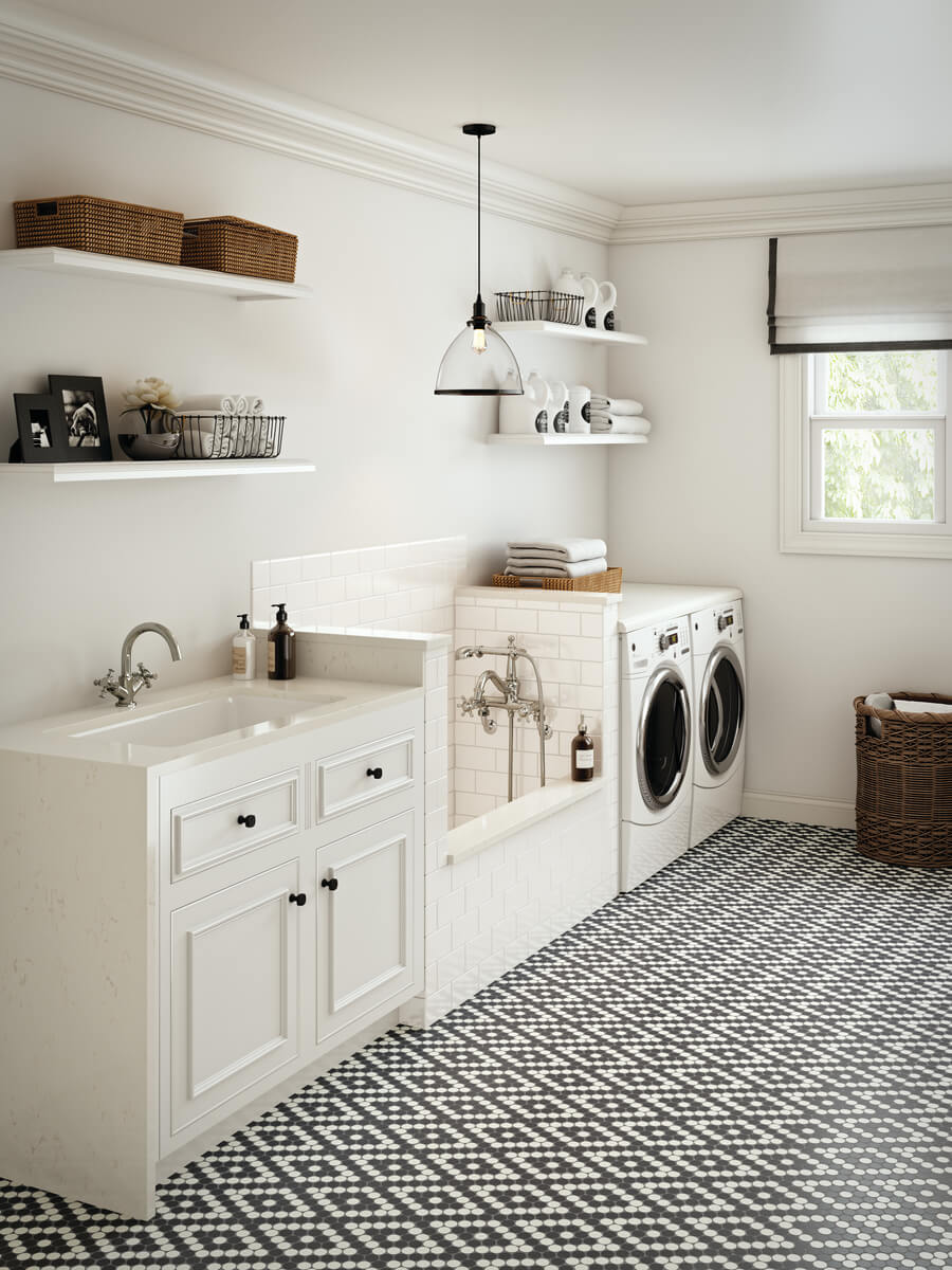 Modern laundry room with penny round tiles in white and black flooring