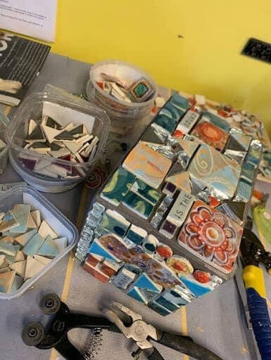creating a custom planter box with colorful ceramic tile pieces